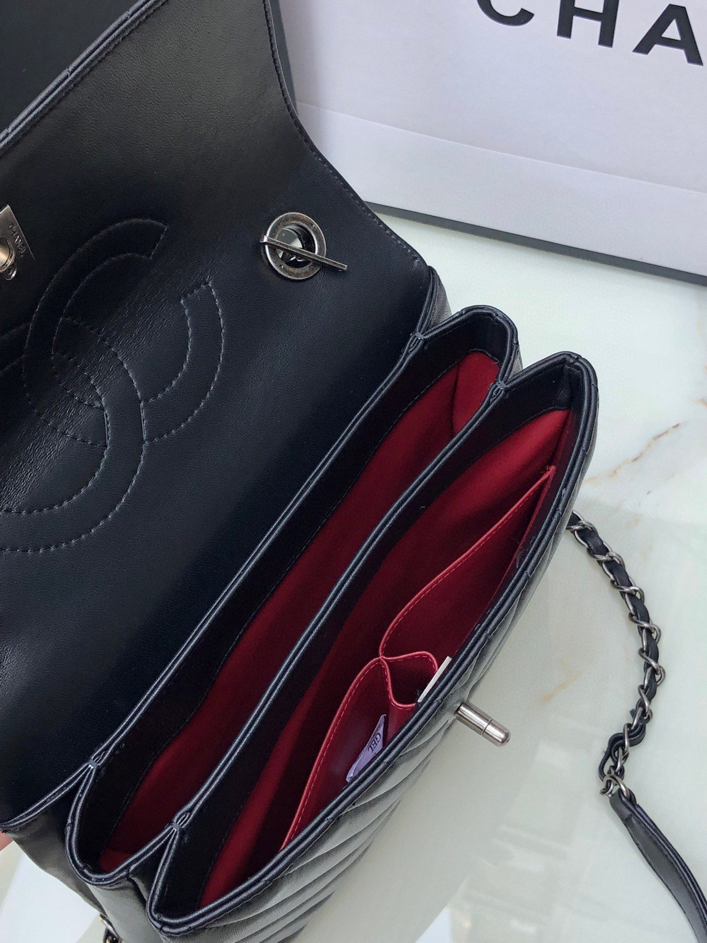 Ch*el flap bag with top handle 6.6 × 9.8 × 4.7 in